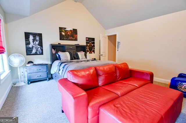 carpeted bedroom with lofted ceiling