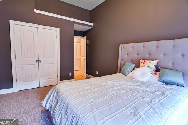 carpeted bedroom featuring a closet