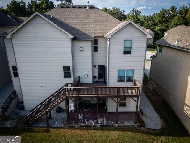 rear view of house with a patio area and a deck