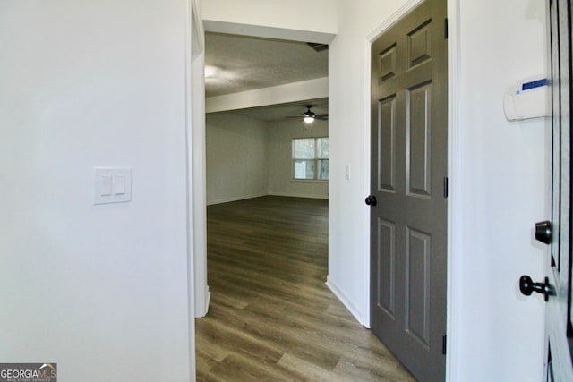 entryway with hardwood / wood-style floors, ceiling fan, and a textured ceiling