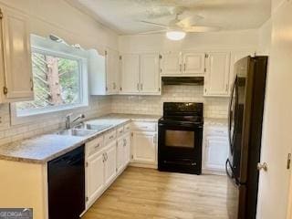 kitchen with black appliances, white cabinetry, sink, ceiling fan, and light hardwood / wood-style flooring