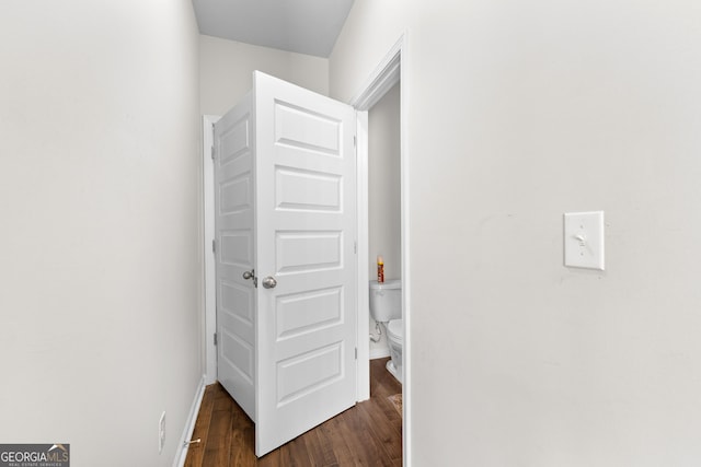 corridor with dark wood-style floors
