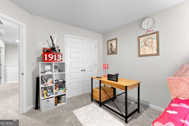 carpeted office space with attic access and baseboards