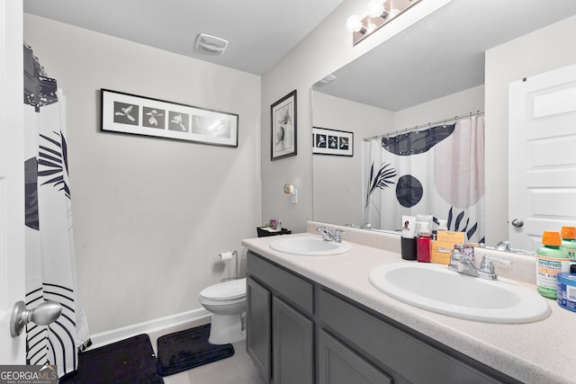 full bath with double vanity, visible vents, toilet, and a sink