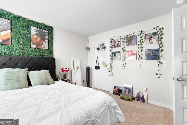 carpeted bedroom with baseboards