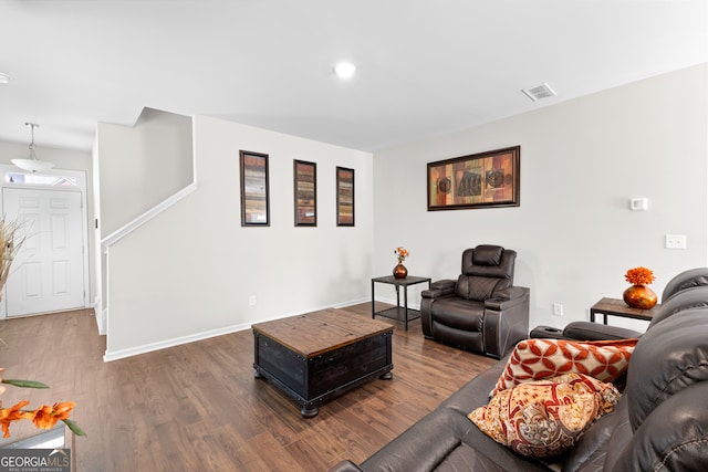 living room with dark hardwood / wood-style flooring