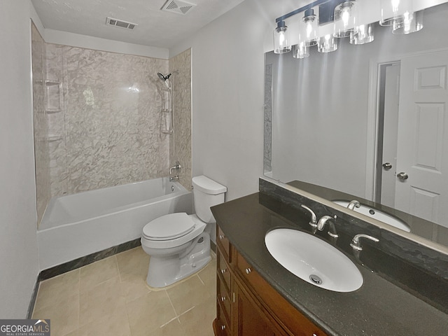 full bathroom with tiled shower / bath combo, vanity, toilet, and tile patterned floors