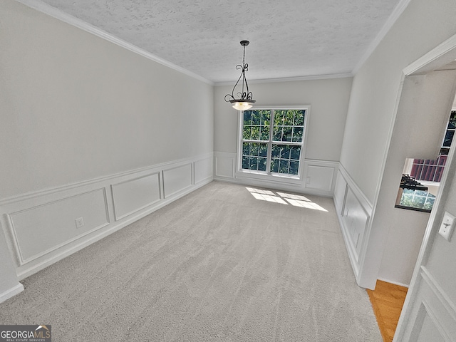 empty room with light carpet, crown molding, and a textured ceiling