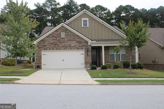 craftsman house featuring a garage and a front yard