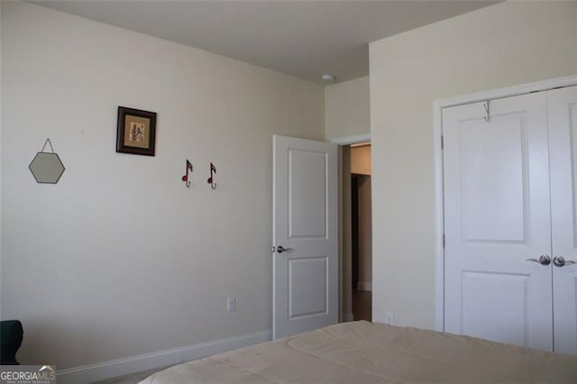 unfurnished bedroom with a closet