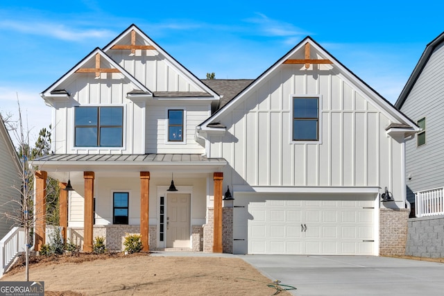 modern farmhouse with a porch and a garage