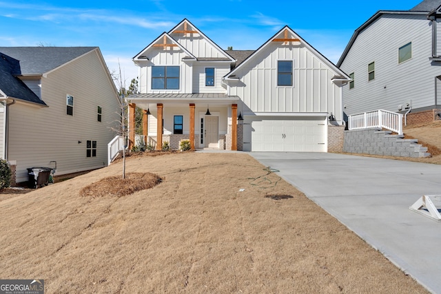 modern farmhouse style home featuring a garage and a porch