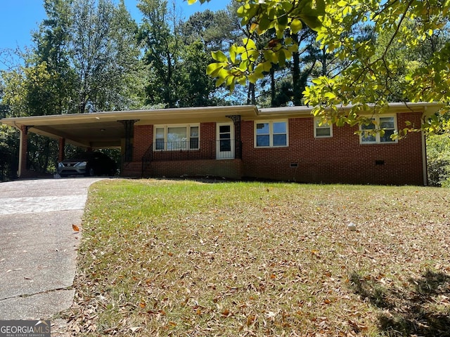 ranch-style home featuring a carport