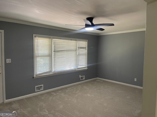 carpeted empty room with crown molding and ceiling fan