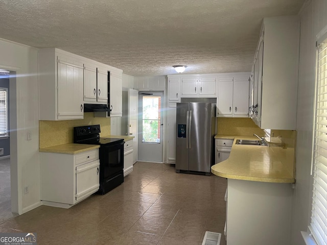 kitchen with range hood, white cabinets, sink, black electric range, and stainless steel fridge with ice dispenser