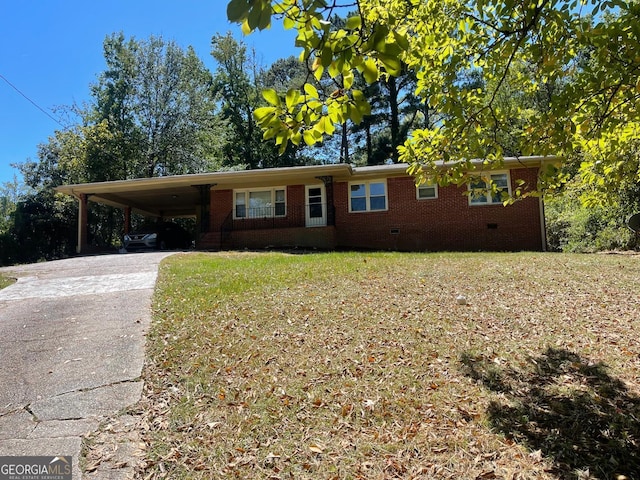 ranch-style home with a front yard and a carport