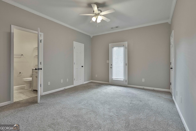 unfurnished bedroom featuring ceiling fan, light colored carpet, and crown molding