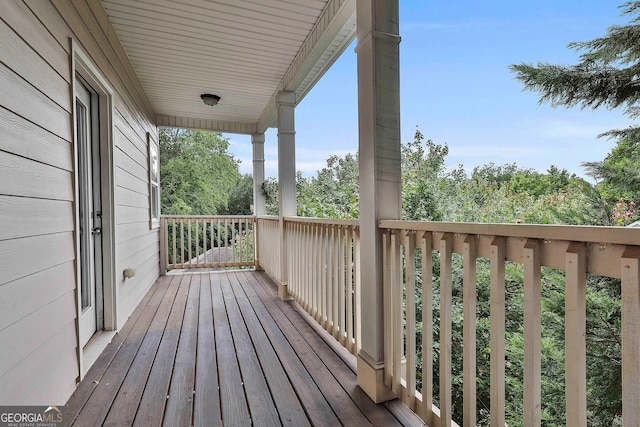 wooden terrace featuring a porch