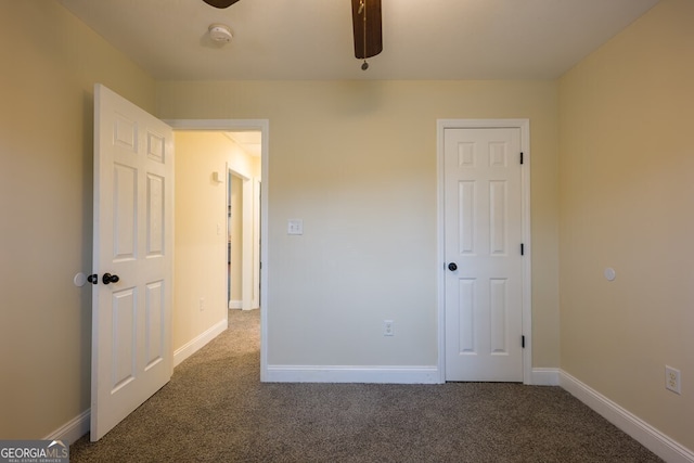 unfurnished bedroom with ceiling fan and carpet flooring