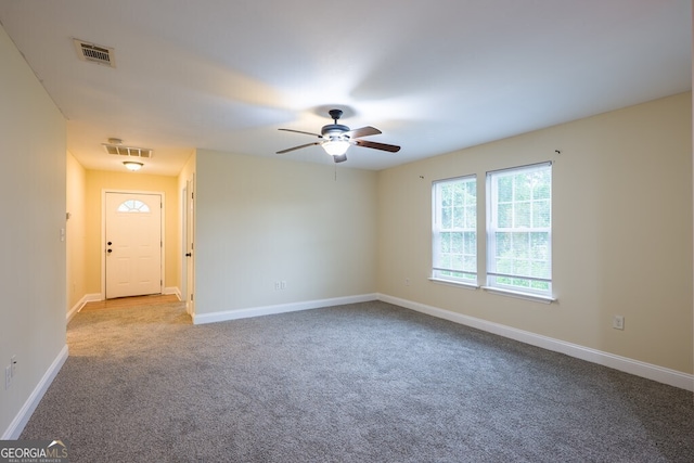 carpeted empty room with ceiling fan