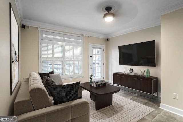 living room featuring ceiling fan and ornamental molding