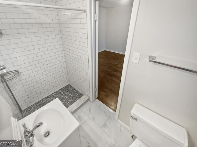 720 Smithstone Rd SE, Marietta, GA 30067 - full bathroom featuring marble finish floor, toilet, a stall shower, and baseboards