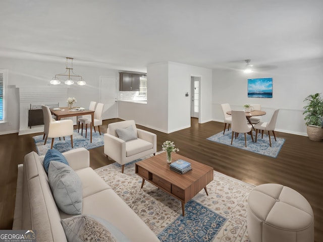 720 Smithstone Rd SE, Marietta, GA 30067 - living area with dark wood finished floors, baseboards, and an inviting chandelier