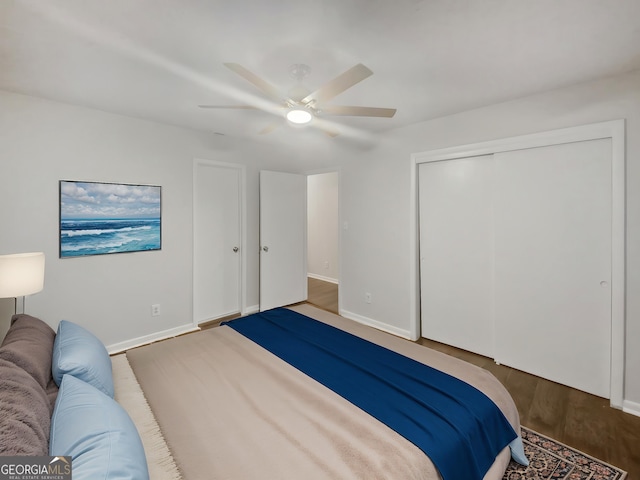 720 Smithstone Rd SE, Marietta, GA 30067 - bedroom featuring baseboards, a closet, wood finished floors, and a ceiling fan