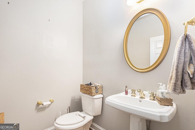 bathroom featuring toilet and sink