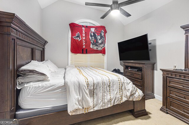 bedroom with vaulted ceiling, light carpet, and ceiling fan