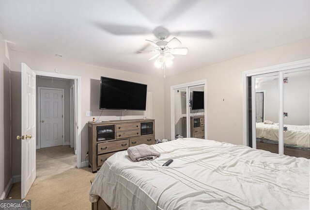 bedroom featuring light carpet and ceiling fan