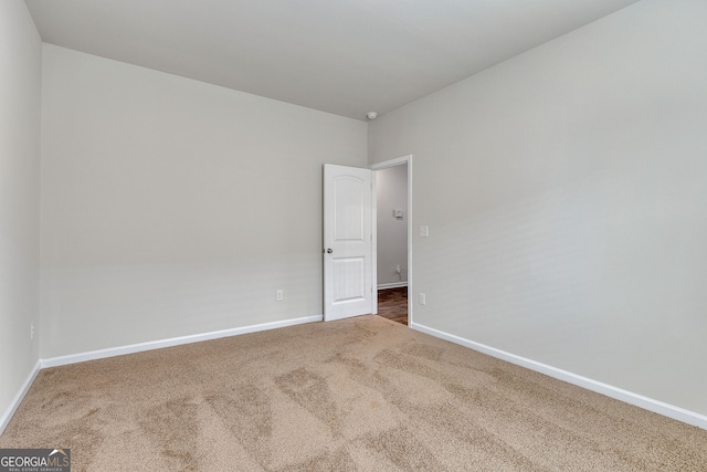 spare room featuring carpet flooring