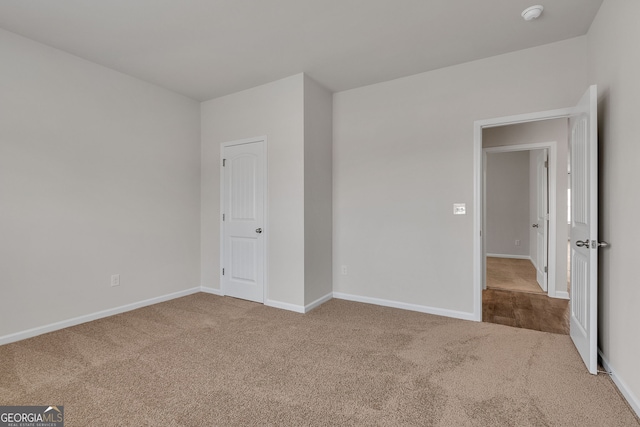 unfurnished bedroom with carpet floors