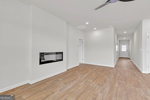 unfurnished room featuring ceiling fan and light wood-type flooring