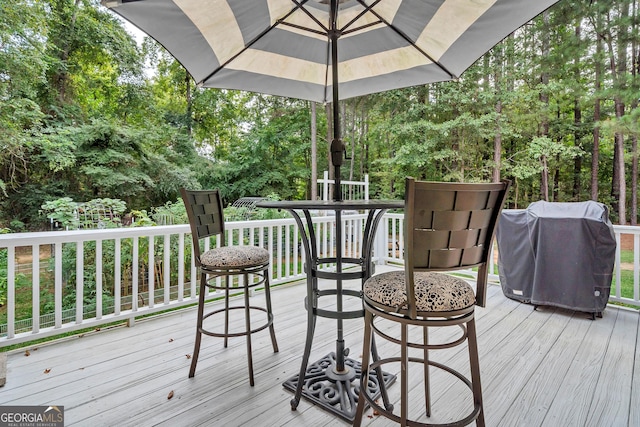 wooden terrace with grilling area