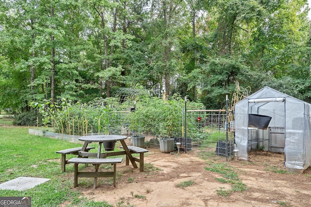 view of yard with an outbuilding and a garden