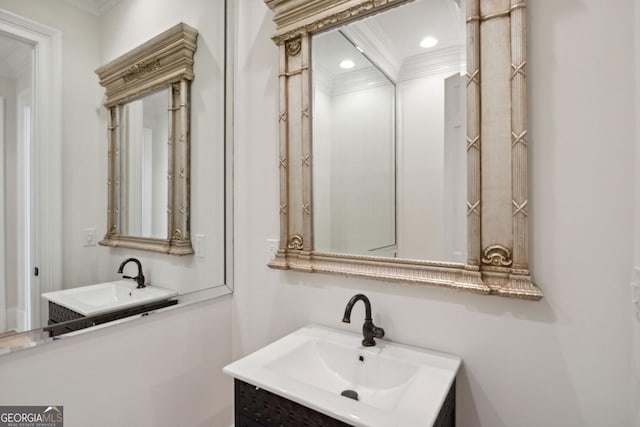 bathroom with vanity and crown molding