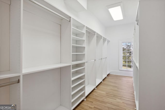 spacious closet featuring hardwood / wood-style flooring