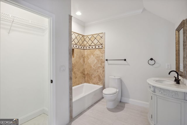 full bathroom with vanity, toilet, tiled shower / bath combo, and vaulted ceiling