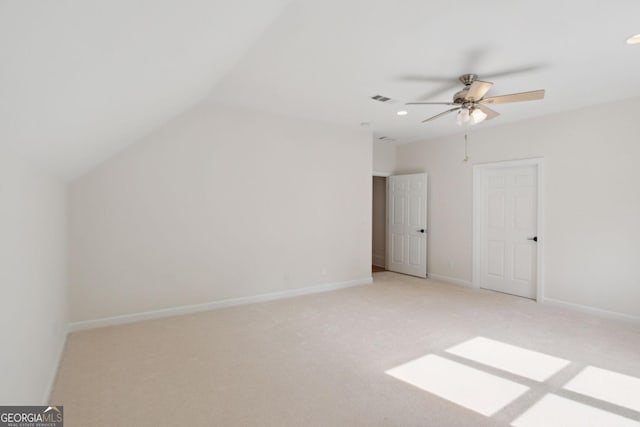 bonus room featuring ceiling fan, light colored carpet, and vaulted ceiling