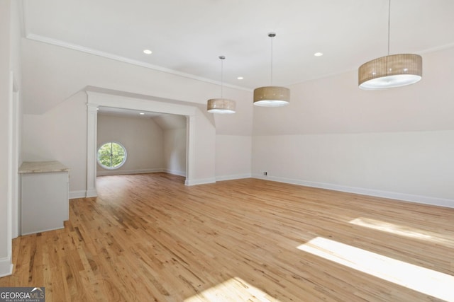 interior space featuring light hardwood / wood-style floors and vaulted ceiling