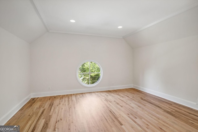 bonus room with vaulted ceiling and light hardwood / wood-style flooring