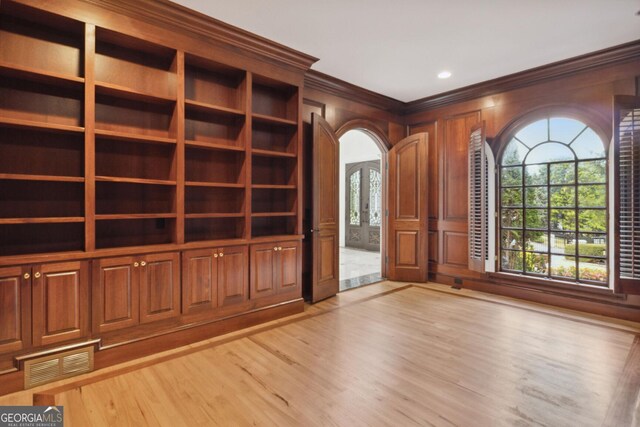 interior space featuring light hardwood / wood-style flooring and ornamental molding