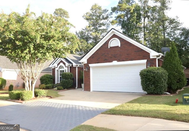 view of front of home featuring a front yard, brick siding, driveway, and an attached garage