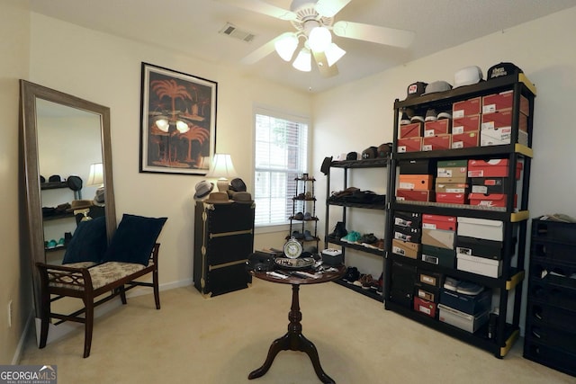 interior space featuring ceiling fan and visible vents