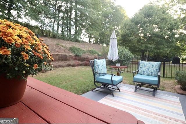 exterior space with a patio, a lawn, and fence