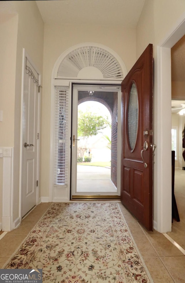 foyer entrance with light tile patterned floors