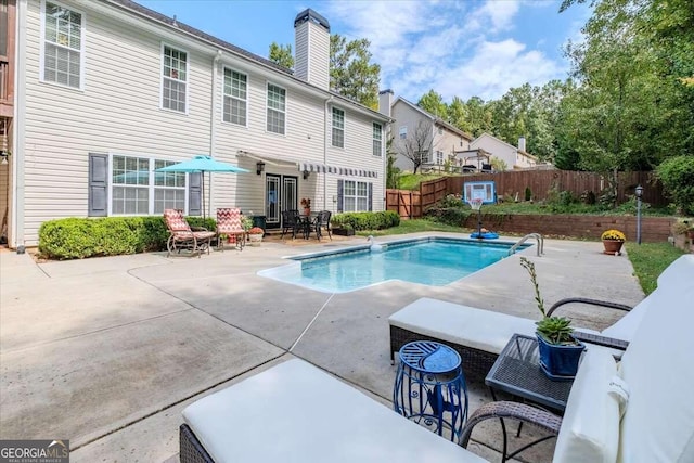 view of swimming pool with a patio area