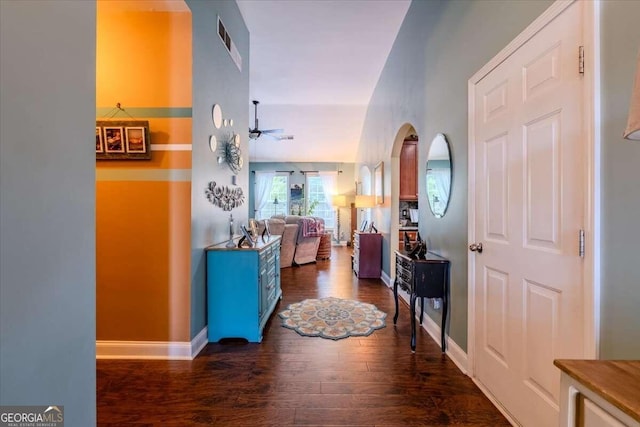 foyer featuring ceiling fan and dark hardwood / wood-style floors