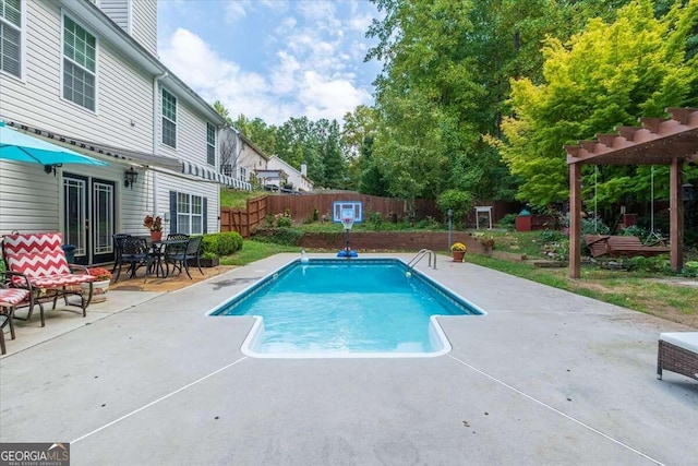 view of swimming pool with a patio area